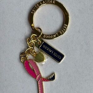 Estée Lauder keychain bag charm pink ribbon gold